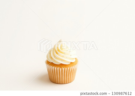 Vanilla cupcake with white frosting on plain background 130987612