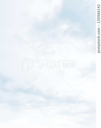 A vertical background image of a pale, bright white-gray cloudy sky with rain clouds floating A vertical background image of a pale, bright white-gray cloudy sky with rain clouds floating 130988142