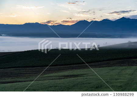 Morning mist and sunrise hills Morning mist and sunrise hills 130988299