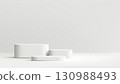 Minimalist white podium with three round platforms for modern product presentation, exhibition display, studio setup, and elegant interior showcase 130988493