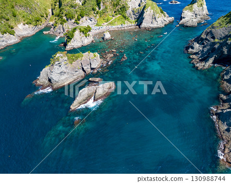 正在進行航拍，以勘察Hirizo海灘及其周圍的島嶼和海域。無人機的飛行得到了當地漁業協會的許可。 130988744