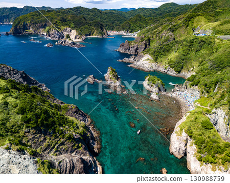 Aerial photography is being carried out to survey Hirizo Beach and the surrounding islands and sea areas. The drone was flown with permission from the local fishing association. 130988759
