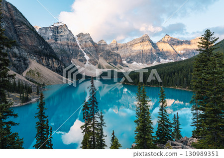 Moraine Lake reflects the Canadian Rockies, showcasing nature's beauty and inspiring awe.. 130989351