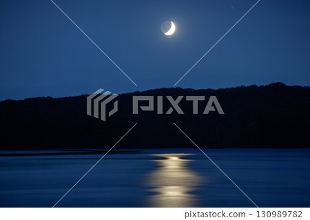 A fantastic moonrise over the lake A fantastic moonrise over the lake 130989782