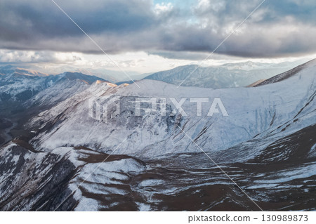 The Splendor of the Caucasus: Snowy Peaks Gleaming in Sunlight The Splendor of the Caucasus: Snowy Peaks Gleaming in Sunlight 130989873