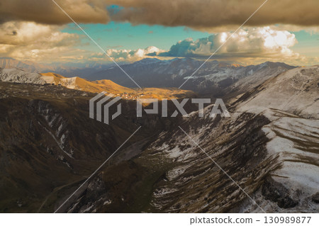 Caucasus Mountains Radiating Sunlight and Majestic Charm 130989877