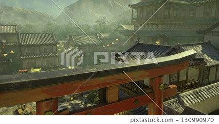 A serene Japanese village sits nestled among misty mountains during dusk. Traditional wooden homes with tiled roofs and lanterns illuminate the surroundings, creating a peaceful atmosphere. 130990970
