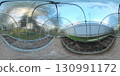 A 360-degree view inside a clear polycarbonate greenhouse with arched frames. Soil beds are prepared on both sides of the central path, ready for planting. Bright natural light fills the space.	 130991172