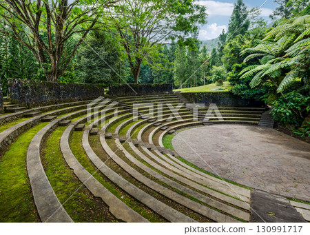 a stone amphitheater in the forest a stone amphitheater in the forest 130991717