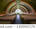 chapel with wooden floor and tables 130992170