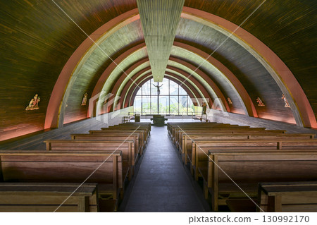 chapel with wooden floor and tables 130992170