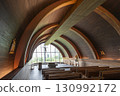 chapel with wooden floor and tables 130992172