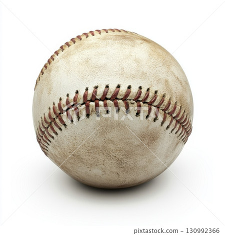 Vintage baseball resting on a flat surface showcasing its aged leather and stitching details 130992366