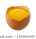 Raw egg yolk in half brown eggshell isolated on white background with clipping path 130992445