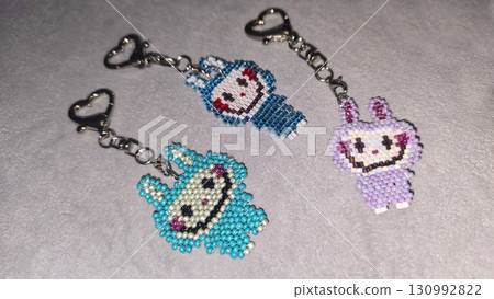 Fashionable handmade keychain toy labubu made of beads, glass beads Copy space Fashionable handmade keychain toy labubu made of beads, glass beads Copy space 130992822