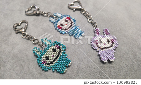 Fashionable handmade keychain toy labubu made of beads, glass beads Copy space Fashionable handmade keychain toy labubu made of beads, glass beads Copy space 130992823