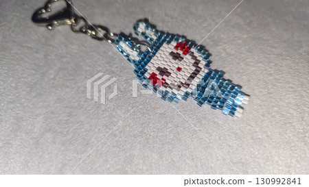 Fashionable handmade keychain toy labubu made of beads, glass beads Copy space 130992841
