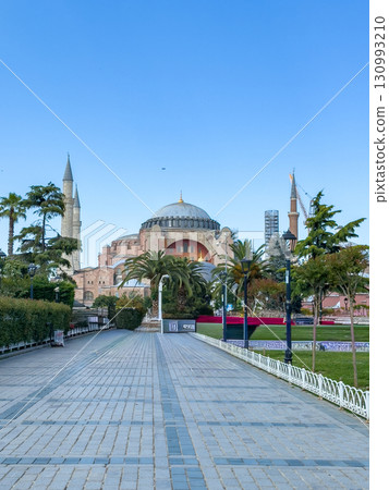 Majestic view of Hagia Sophia (Hagia Sophia) in Istanbul. In the foreground is an empty stone path leading to the famous landmark. The photo conveys the calm atmosphere of the early morning. 130993210