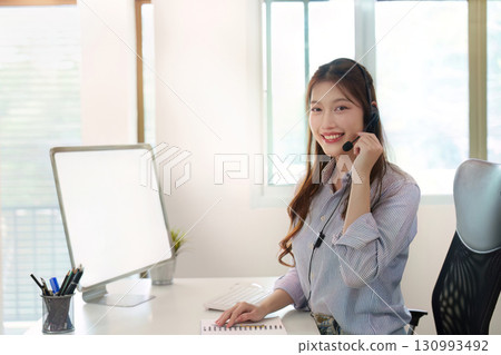 Call Center Agent Providing Customer Support in Modern Office Call Center Agent Providing Customer Support in Modern Office 130993492