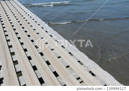 Next to a stylish pier 130994127