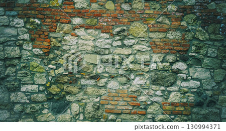 wall of an old building from cobblestones toned close up 130994371