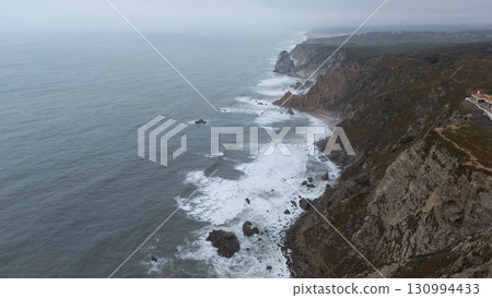 Experience stunning coastal landscapes with waves crashing against rugged cliffs Experience stunning coastal landscapes with waves crashing against rugged cliffs 130994433