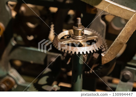 cogwheel gear vintage steel part of the mechanism close-up cogwheel gear vintage steel part of the mechanism close-up 130994447
