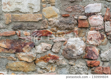 abstract stone background of stones and bricks wall of an old house abstract stone background of stones and bricks wall of an old house 130994604