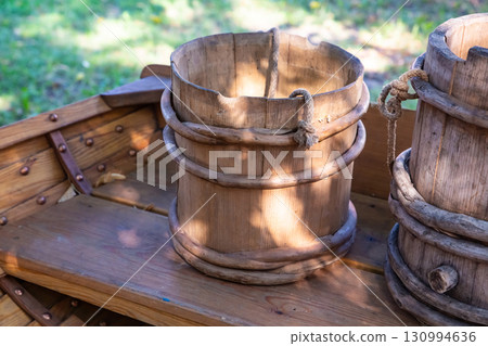old and cracked wooden buckets traditional water container 130994636