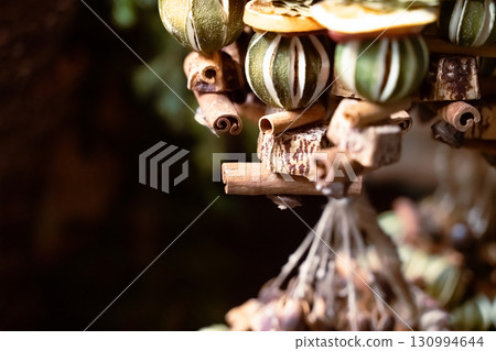 traditional austrian christmas decoration made of dried fruits and plants close up with copy space, selective focus 130994644