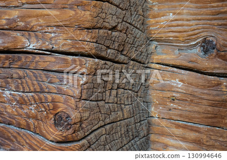 old wooden beams weathered and cracked boards close-up 130994646