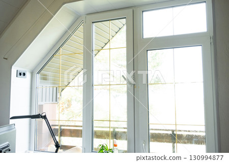 Window attic from inside the house plastic double-glazed window, clean glass after cleaning windows, open and closed window, window fittings Window attic from inside the house plastic double-glazed window, clean glass after cleaning windows, open and closed window, window fittings 130994877