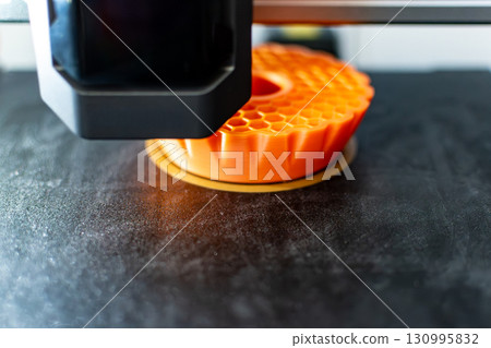 3d printer printing an object on the tray with pla filament, corn starch, non-waterproof filament 3d printer printing an object on the tray with pla filament, corn starch, non-waterproof filament 130995832
