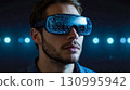 Man in VR Headset Against Glowing Lights 130995942