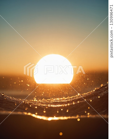 The concept of the sun and water. Drops of water shimmer in the backlight. 130996471