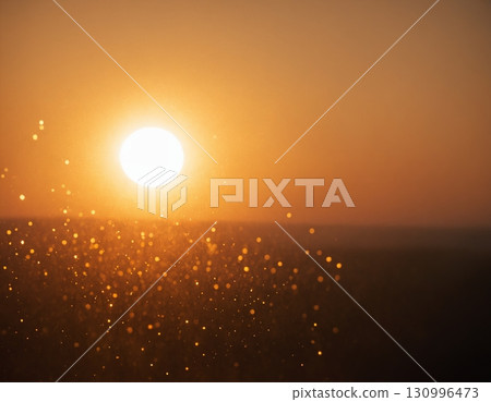 The concept of the sun and water. Drops of water shimmer in the backlight. 130996473