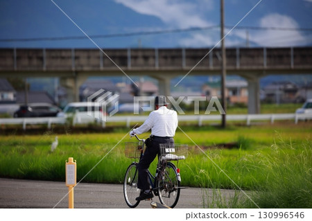 An old man wandering around on a bicycle An old man wandering around on a bicycle 130996546