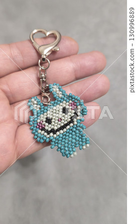 Fashionable handmade keychain toy labubu made of beads, glass beads Copy space Fashionable handmade keychain toy labubu made of beads, glass beads Copy space 130996889