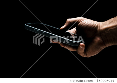 composite image of hand holding smartphone composite image of hand holding smartphone 130996945