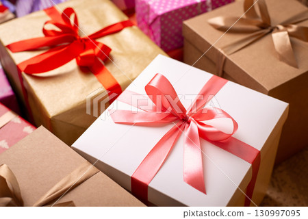 Big boxes-presents for Christmas with bright colorful ribbons. Christmas background 130997095