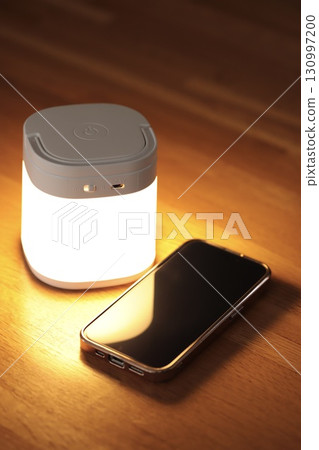 Night light and smartphone Smartphone in the bedroom at night Night light and smartphone Smartphone in the bedroom at night 130997200