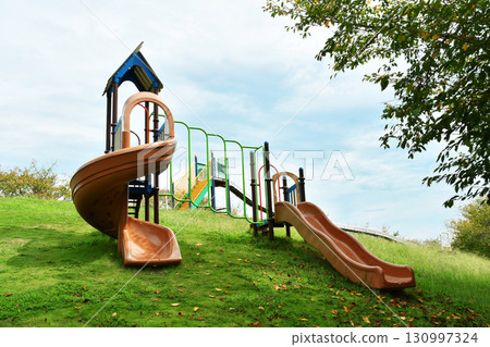 The long and small slides in the park The long and small slides in the park 130997324