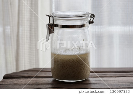 Freshly mixed homemade shio koji made from dried koji that has just begun to foam. 130997523