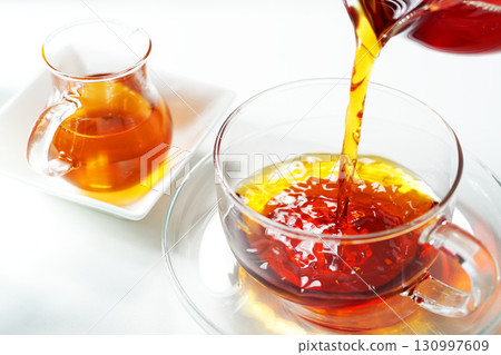 Honey tea poured into a teacup Honey tea poured into a teacup 130997609