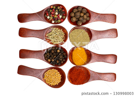 Spices in a wooden spoon isolated Spices in a wooden spoon isolated 130998003