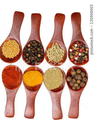 Spices in a wooden spoon isolated Spices in a wooden spoon isolated 130998005