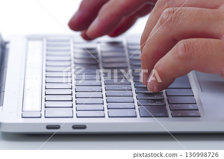 Close-up of hands typing on a computer Close-up of hands typing on a computer 130998726