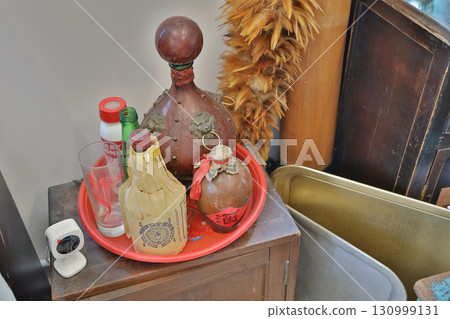 Sept 13 2025 Collection of Vintage Bottles and Decorative Items on a Tray 130999131