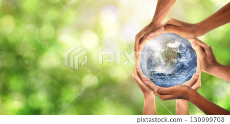 Conceptual symbol of multiracial human hands surrounding the Earth globe. Unity, world peace, humanity concept. World environment day- Earth Day concept. 130999708