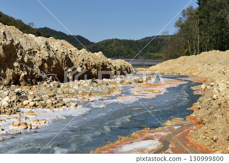 Acid mine water drainage flow, toxic mine waters polluting the environment 130999800